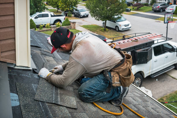 Professional Roofing technician working in Manchester, NY
